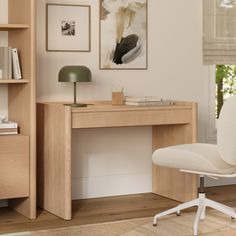 a white chair sitting in front of a wooden desk