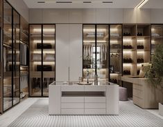 a walk in closet with lots of shelves and drawers