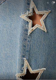 a close up of a person's jeans with a star on the back of it