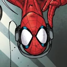 the spider - man is wearing headphones and listening to music