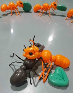 an orange and black toy anteater surrounded by other toys