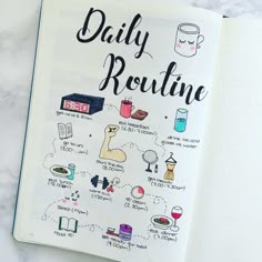 the daily routine book is open on top of a white table with coffee and other items