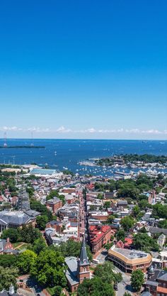 an aerial view of a city with water in the background