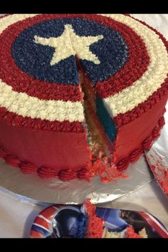 the cake is decorated with red, white and blue icing as well as a captain's shield