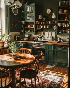 a kitchen filled with lots of wooden furniture and green cabinets on top of a hard wood floor
