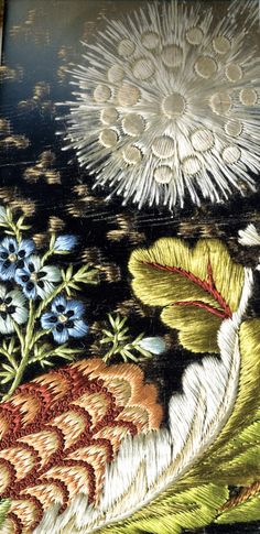 an artistic painting with flowers and birds on it's side, in the middle of a frame