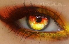 an eye with yellow and orange colors on it