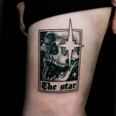 a tattoo on the side of a woman's thigh that reads, the star