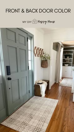 the front door is painted blue and has a white rug on it, along with a basket