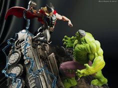 the action figure is being displayed in front of a black background with an image of hulk and thor