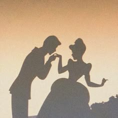 the shadow of two people standing next to each other