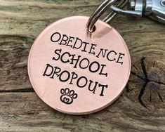 Funny Dog TagCustom 2-Sided Pet ID Tag Handstamped With 'Obedience School DropoutThe dog's name and up to 2 phone numbers will be stamped on the back of the tagOne phone number can be replaced with 'microchippedAvailable in CopperBrass or Nickel Silver Round Dog Tag 35 mm (1 3/8 inFor mediumlarge dog breedsPersonalized gift messagewrappings://etsy.me/3kIl3Eya split ring is includedAvoid losing your dog tag and attach it safelys://www.etsy.com/ie/listin