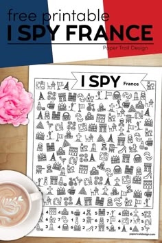a printable spy france page with a cup of coffee next to it and a pink flower