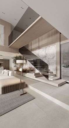a modern living room with white furniture and marble stairs leading up to the second floor