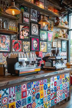 the interior of a coffee shop with colorful tiles on the wall and pictures above it