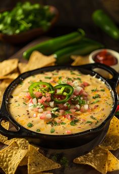 a bowl of quesadilla dip surrounded by tortilla chips