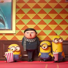three minion characters are standing next to each other