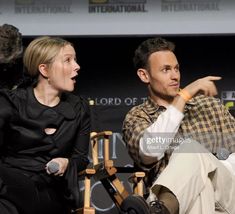 the actors are sitting in chairs talking to each other