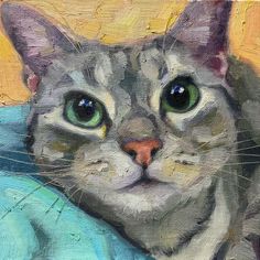 a painting of a grey cat with green eyes and whiskers on it's head