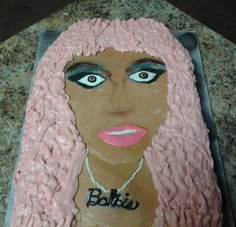 a cake with a woman's face on it