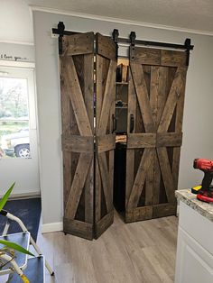 an open barn door in the middle of a room
