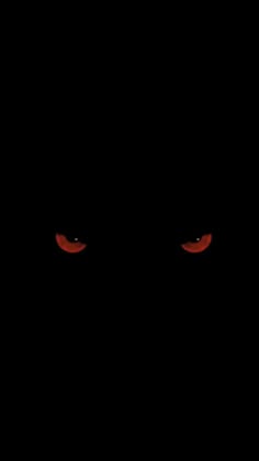red eyes in the dark on a black background
