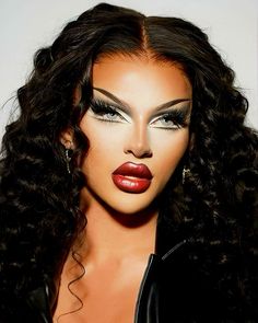 a woman with long black hair and red lipstick