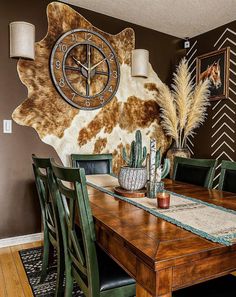 a dining room table with chairs and a clock on the wall