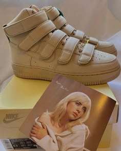 a pair of nike sneakers and a magazine