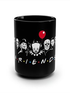 a black coffee mug with the words friends on it and three clowns holding a red balloon