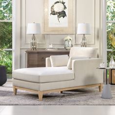 a living room scene with focus on the chaise lounge chair and side table in the foreground