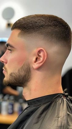 NOT MY PIC, PLEASE DM FOR CREDIT/REMOVAL. Looking for a fresh cut? Low bald fades are where clean meets cool! 🔥 From sharp lines to creative details, this versatile haircut is perfect for keeping it sleek in spring, summer, or all year round. Whether it’s work vibes or weekend chill, a low bald fade has you covered. #LowBaldFade #FreshHaircuts #MenHaircuts #FadeHaircuts #TrendyMensCuts #SpringGrooming #SummerHairstyles Low Skin Fade Buzzcut, Low Bald Fade Straight Hair, Low Bald Fade Men, Low Fade Buzz, Low Fade Buzzcut, Buzz Cut With Low Fade, Long Buzz Cut With Low Bald Fade, Low Buzz Cut Fade, Buzzcut Men Low Fade