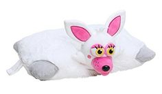a white stuffed animal laying on top of a pillow with pink eyes and nose sticking out