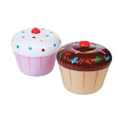 two cupcakes are sitting next to each other on a white background with chinese writing