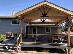 a covered patio with stairs leading up to it