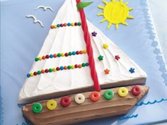 a birthday cake shaped like a sailboat