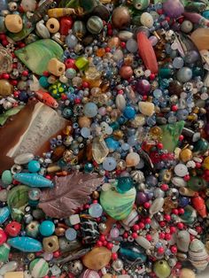 many different colored beads are scattered together