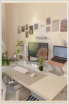 a desk with a laptop, monitor and keyboard on it