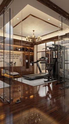 an empty gym with mirrors on the wall and hard wood flooring in front of it