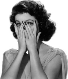 a black and white photo of a woman covering her eyes