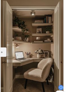 a chair sitting in front of a desk with a laptop computer on top of it