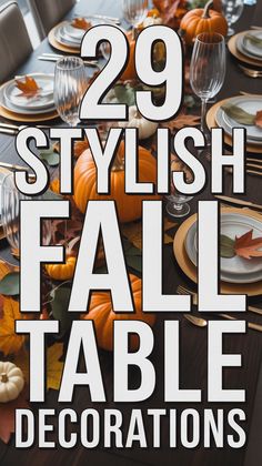 Elegant fall table decor with pumpkins, autumn leaves, gold accents, and layered plates on a dark wood table.