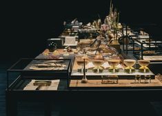 a long table filled with lots of food and wine glasses