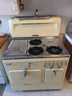 an old fashioned stove with two burners in a kitchen