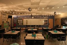 an empty classroom with desks and lights on the ceiling is pictured in this image