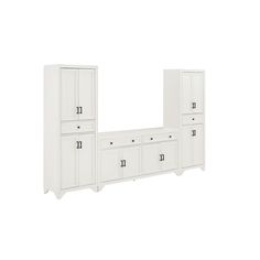 an image of a white bedroom set with drawers and cupboards on the wall in front of it