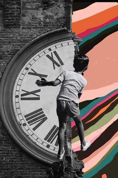 a young boy climbing up the side of a building next to a large clock with roman numerals on it