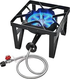a gas stove with a hose attached to it