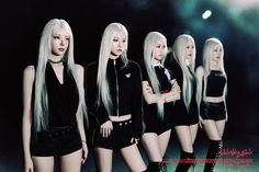 four beautiful young women standing next to each other in short shorts and black tops with long white hair