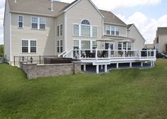 a large house with a deck in front of it